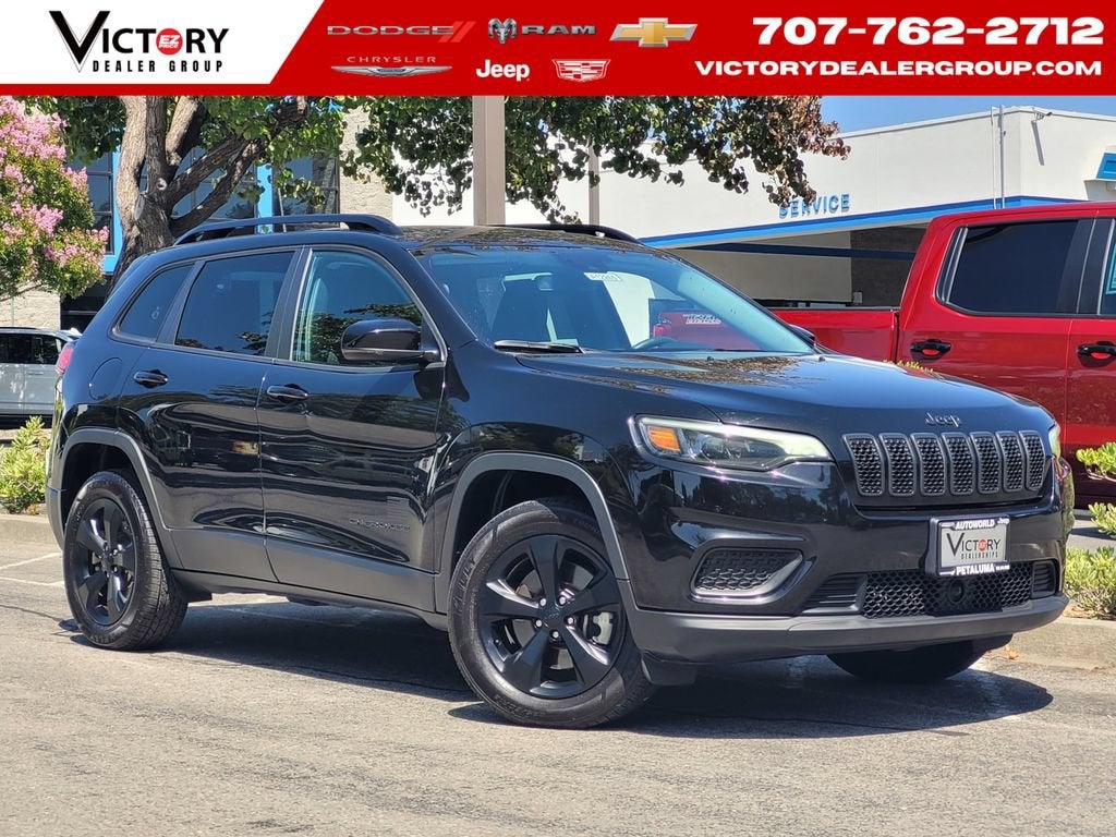 2021 Jeep Cherokee Freedom in Met Black — front three-quarter view