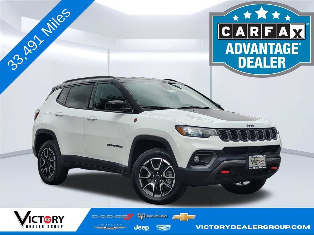 2025 Jeep Compass Trailhawk in White — front three-quarter view