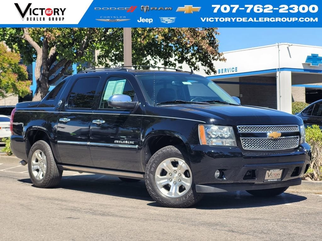 2013 Chevrolet Avalanche LTZ in Black — front three-quarter view